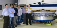CEFCA team and AMOS staff next to the mirrors